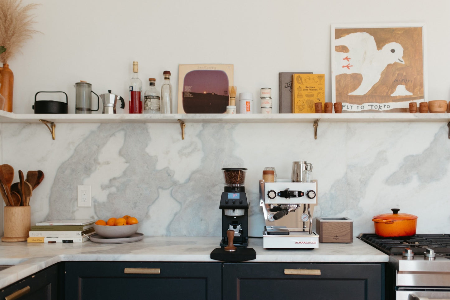 La Marzocco Pico coffee grinder on a kitchen bench beside an espresso machine